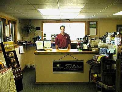 Shop on Our Pro Shop Manager Kevin Neilsen Behind The Pro Shop Desk